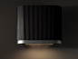 This may contain: a black and silver wall mounted light with dim lighting on it's side in a dark room