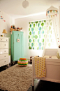 This is Juniper’s bedroom with a pouf knitted by Gina’s mom and an armoire from a flea market in Park Slope. She’ll need to get a little older before dad has time to build replacements fo