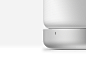 This may contain: an image of a white speaker on top of a table