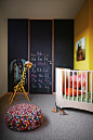  A Leander cot balances this bright, colourful nursery.