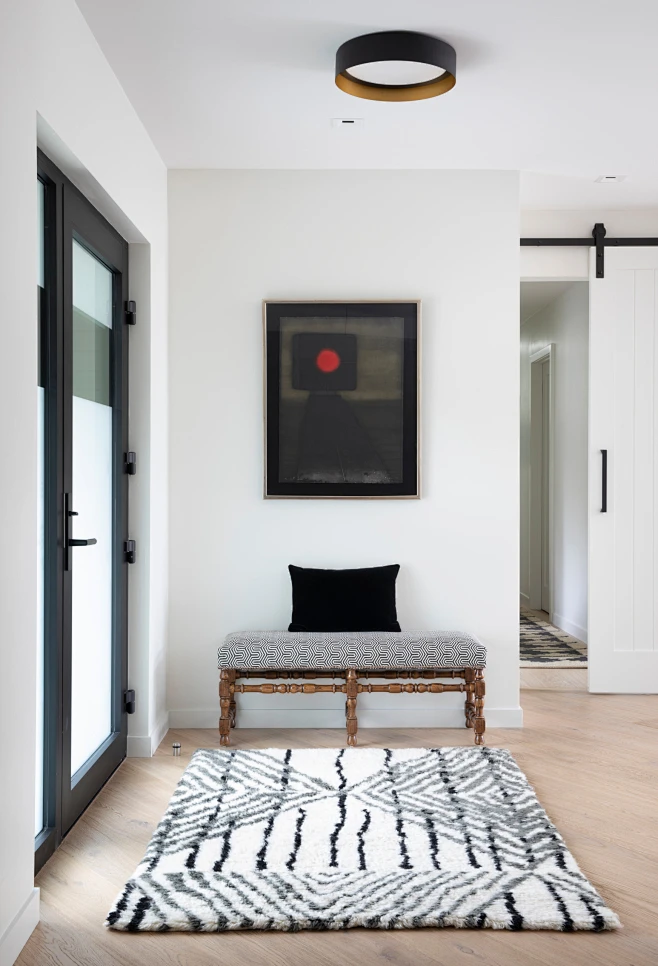 Example of a mid-sized danish light wood floor and brown floor entryway ...