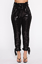 Shimmer of Hope Sequin Pants - Black : Available In Black.Sequin PantsHigh RisePaperbag WaistTie BeltTie Ankle DetailButton And Zipper ClosureSelf: 100% Polyester Mesh Sequins Contrast: 95% Polyester 5% Spandex Lining: 100% PolyesterImported