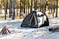 Campfire and tent in the nature