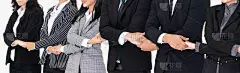 Successful business people standing together