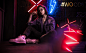 People 2559x1582 Olya Pushkina women model brunette looking at viewer women with glasses jeans jacket jeans Converse on the floor sitting neon lights women indoors