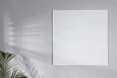 点击来源直接获取大图文件 |Blank canvas on light grey wall indoors. Space for design
