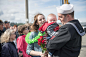 180509-N-DA737-0162 : EVERETT, Wash. (May 9, 2018) Information Systems Technician 1st Class Ryan Walo, assigned to USS Sampson (DDG 102), holds his four-month old child on the pier after the guided-missile destroyer's return home to Naval Station Everett 