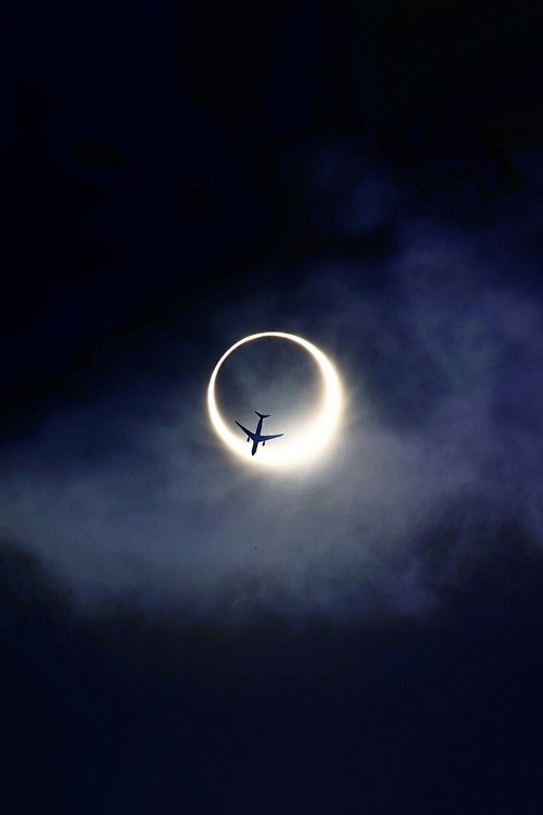 Plane over an eclips...