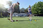Caucasian women playing croquet on lawn by Gable Denims on 500px