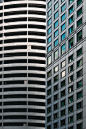 a tall building next to a smaller building