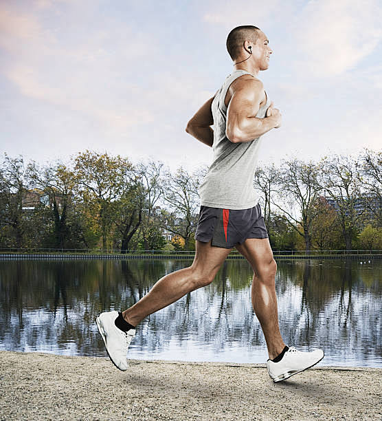Man jogging by a lak...