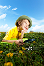 Little Boy Looking Through Magnifying Glass