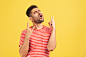 emotional-young-man-red-tshirt-yellow-background
