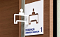environmental wayfinding signage with perpendicular graphic cut-out