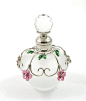 Round frosted perfume bottle with flower decoration