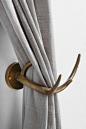 Magical Thinking Antler Curtain Tieback - Urban Outfitters --- We have these in our front 'sitting' room and they're a lot nicer than I would have thought given the price.