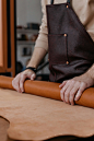 Free Close-Up Shot of a Person Rolling a Leather Textile Stock Photo