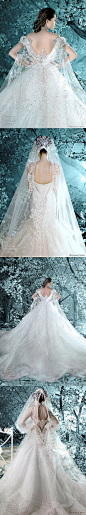 Michael Cinco 婚纱系列。头纱中间的镂空很创意，后背设计很美
