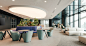 arrival-area-with-multiple-lounge-settings-at-wtw-paris-office