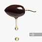 Olive oil dripping from black olive_创意图片