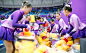 Venue staff members collect Winnie the Pooh dolls thrown into the rink after Japanese figure skater Yuzuru Hanyu's short program performance at the...