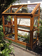 Homemade greenhouse up against the house:
