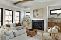 Minimalist open concept light wood floor and vaulted ceiling living room photo in Minneapolis with white walls and a standard fireplace