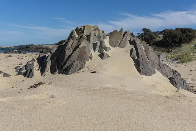 photos of Spiky Rocks Beach : Sharp rock formations of a sandy ...