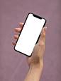 Free Photo | Female hand holding a smartphone with blank screen