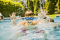 Boy splashing in swimming pool by Gable Denims on 500px