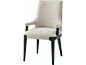 This may contain: an upholstered chair with black legs and a light colored fabric on the back