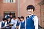 Royalty-free Image: Young student standing confidently in the foreground