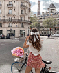 Photo shared by Femme Fatale on July 28, 2021 tagging @onparledemode, and @alexfashionbreak. May be an image of one or more people, people standing, bicycle and outdoors.