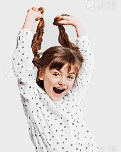 Cute little girl holding her hair