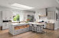 Example of a large trendy u-shaped light wood floor and brown floor eat-in kitchen design in San Diego with an undermount sink, flat-panel cabinets, gray cabinets, marble countertops, white backsplash, porcelain backsplash, stainless steel appliances, an 