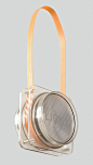 This may contain: a light that is hanging from the side of a wall with an orange strap around it
