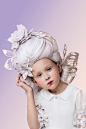 Skyscraper on the Head. Baroque paper wigs 2 : Skyscraper on the HeadBaroque and Rococo wigs used to be adorned with symbols of luxury, sophistication and the romantic spirit of the time. They were frequently bedecked with model frigates and intricate sti