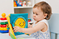 baby girl playing with educational toy in nursery by Yuliya  Shangarey Shangarey on 500px