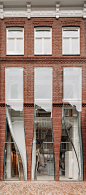 UNStudio mimics textiles with glass for facade of Amsterdam store : UNStudio has created three curved glass boxes that "mimic billowing transparent cloth" from the facade of a store on PC Hooftstraat in Amsterdam.