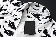 Tom Fella : Tom Fella is a fashion brand located in San Pedro Garza García, Mexico. It's approach is a timeless minimal design representing feminine &amp; masculine taste blended in a women's fashion brand. The icon represents a man's bowtie along with a 