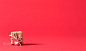 Present box on a red background by Michiko Tierney on 500px