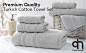 Grey bath towels, hand towels and washcloths on counter in bathroom 