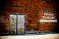 public-domain-images-free-stock-photos-brick-wall-rustic-old-metal-doors-private-parking-1000x664
