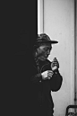 man lighting cigarette stick
