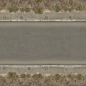 Seamless texture of asphalt road in dark grey tone with clean, smooth surface and rough edges.