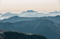 a view of a mountain range from the top of a mountain