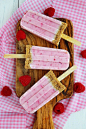 Raspberry Cheesecake Popsicles- I bet blueberry would be just as good...