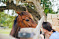 Woman looking at horse through fence by Ysbrand Cosijn on 500px