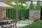 Exquisite Outdoor Living : Luxurious and inviting, this superb backyard design by Zaremba & Company features stunning gardens, a formal pool and cushioned, fireside seating. In addition, a deluxe outdoor kitchen serves guests fabulous meals that can b