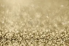 抽象的金色闪光闪烁与散景背景模糊